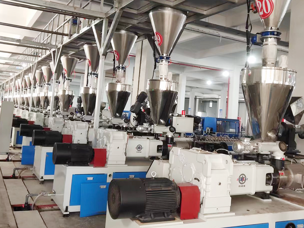 PVC extrusion machines in plastic panel production workshop